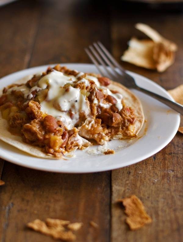 Crockpot chalupas on a plate with a fork.