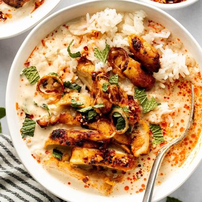 Broth bowls with rice and chicken.