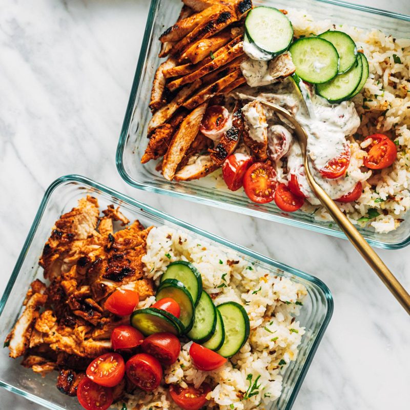 Buffalo chicken bowls in meal prep containers.