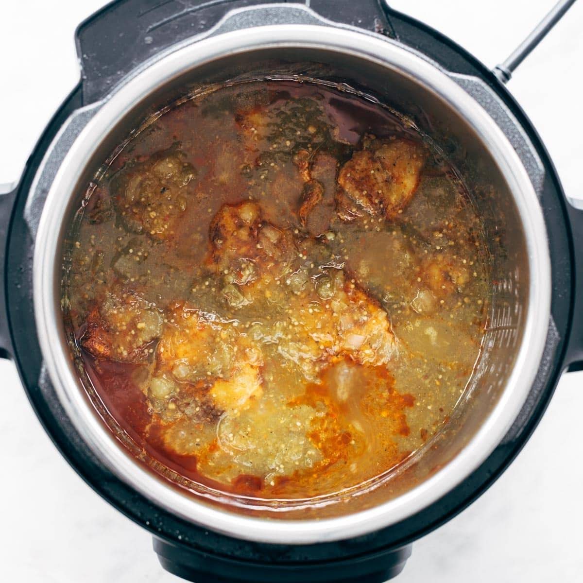 Salsa and chicken in an Instant Pot.