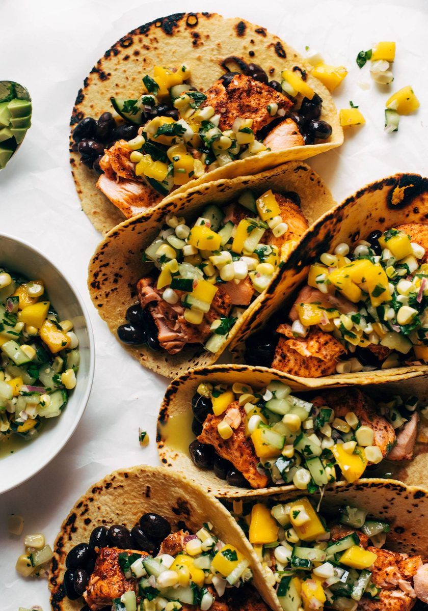 Salmon tacos with cucumber salsa lined up
