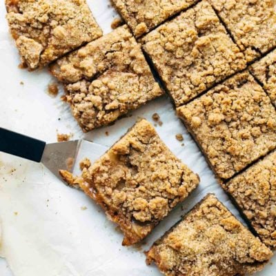 Caramel Apple Crisp Bars sliced with spatula.