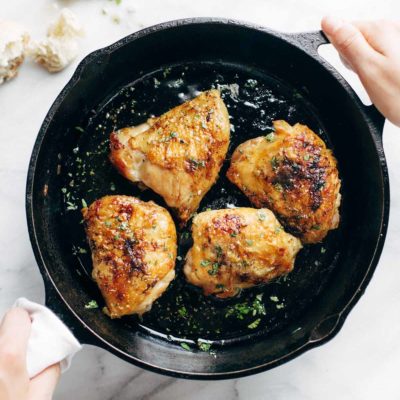 Honey Lemon Chicken in a cast iron pan.