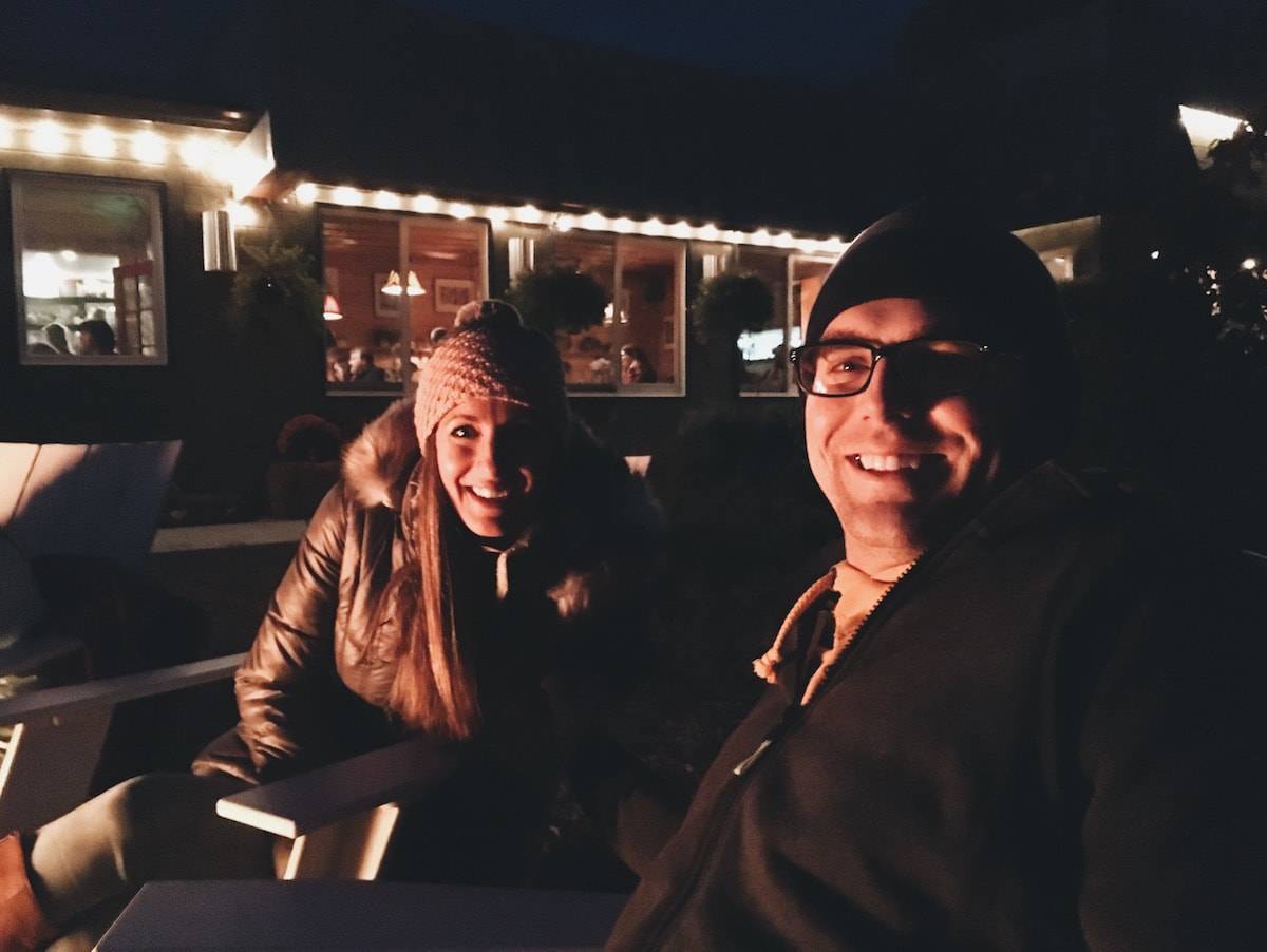 Man and woman sitting in the dark.