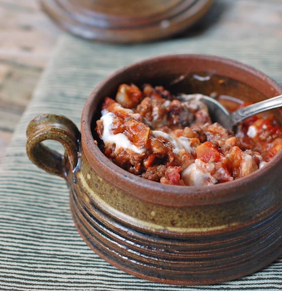 White bean chili in a bowl with a spoon.