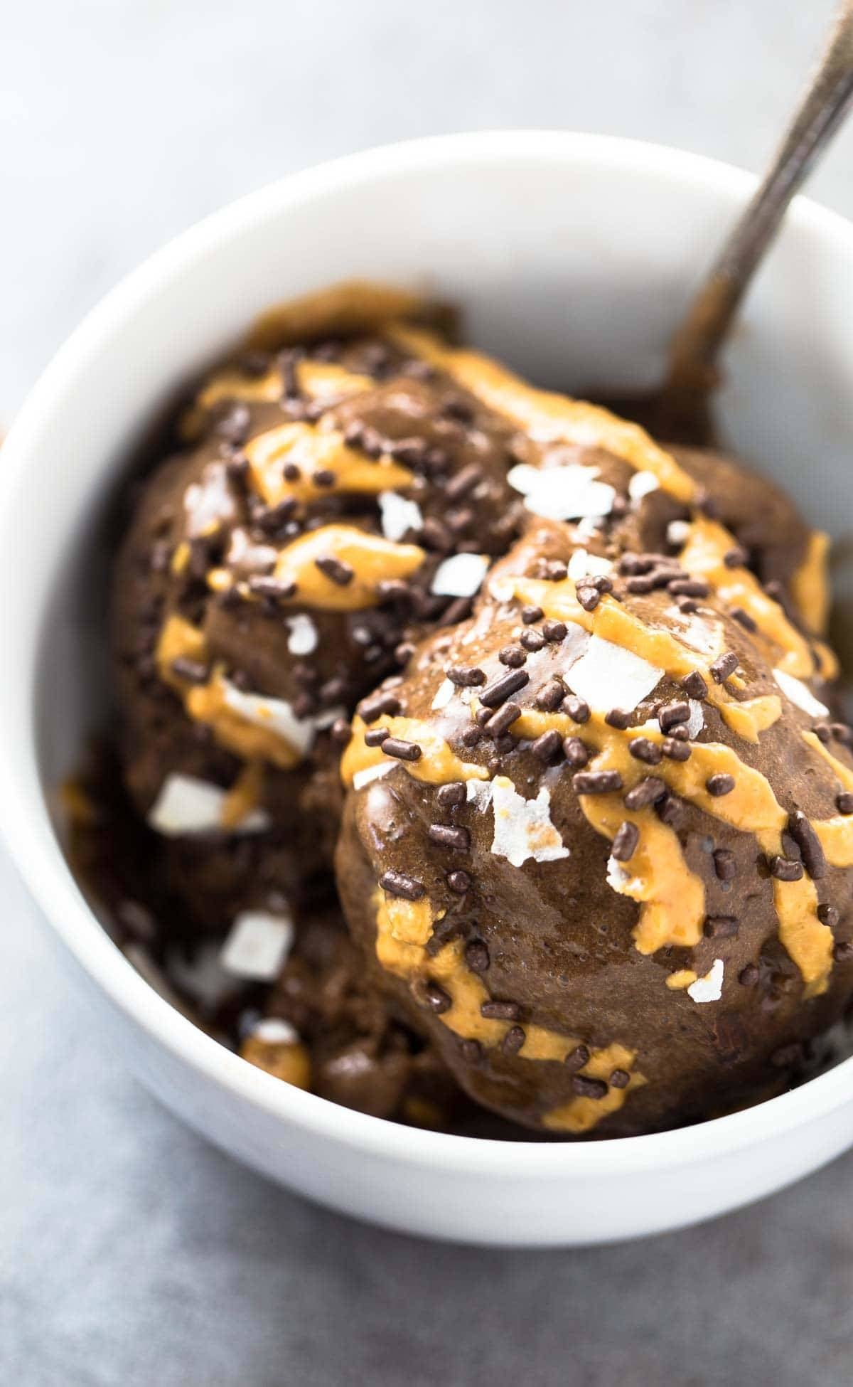 This naturally sweet ice cream is made with ALOHA superfood chocolate and bananas! You won't believe it's only 3 ingredients and 5 minutes to make! | pinchofyum.com
